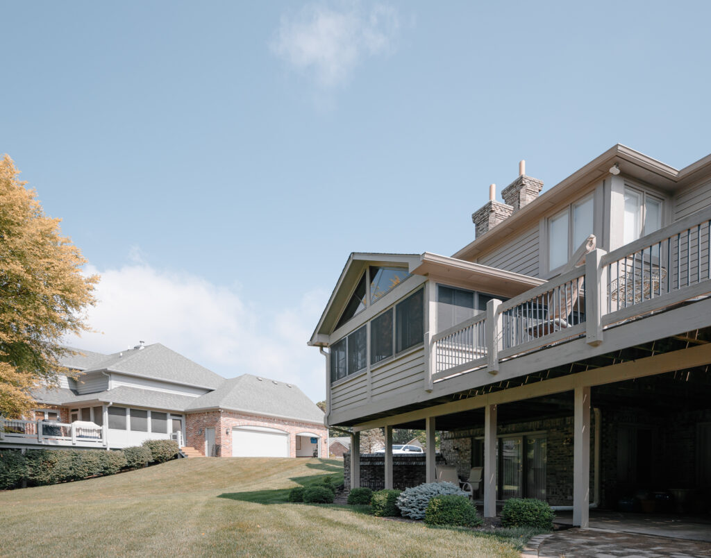 Raised deck enclosed with screen and vinyl windows