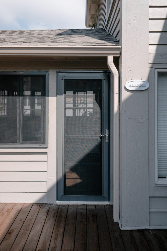 Entry door on a screen and vinyl enclosure