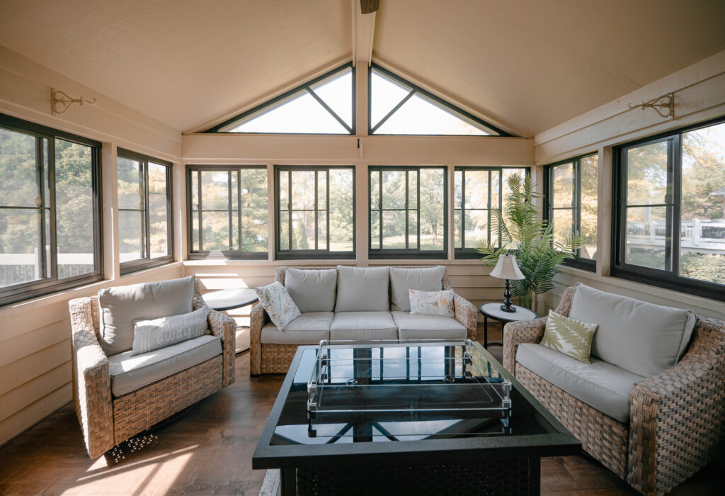 Trapezoid fixed lites filling a gable above an enclosed porch