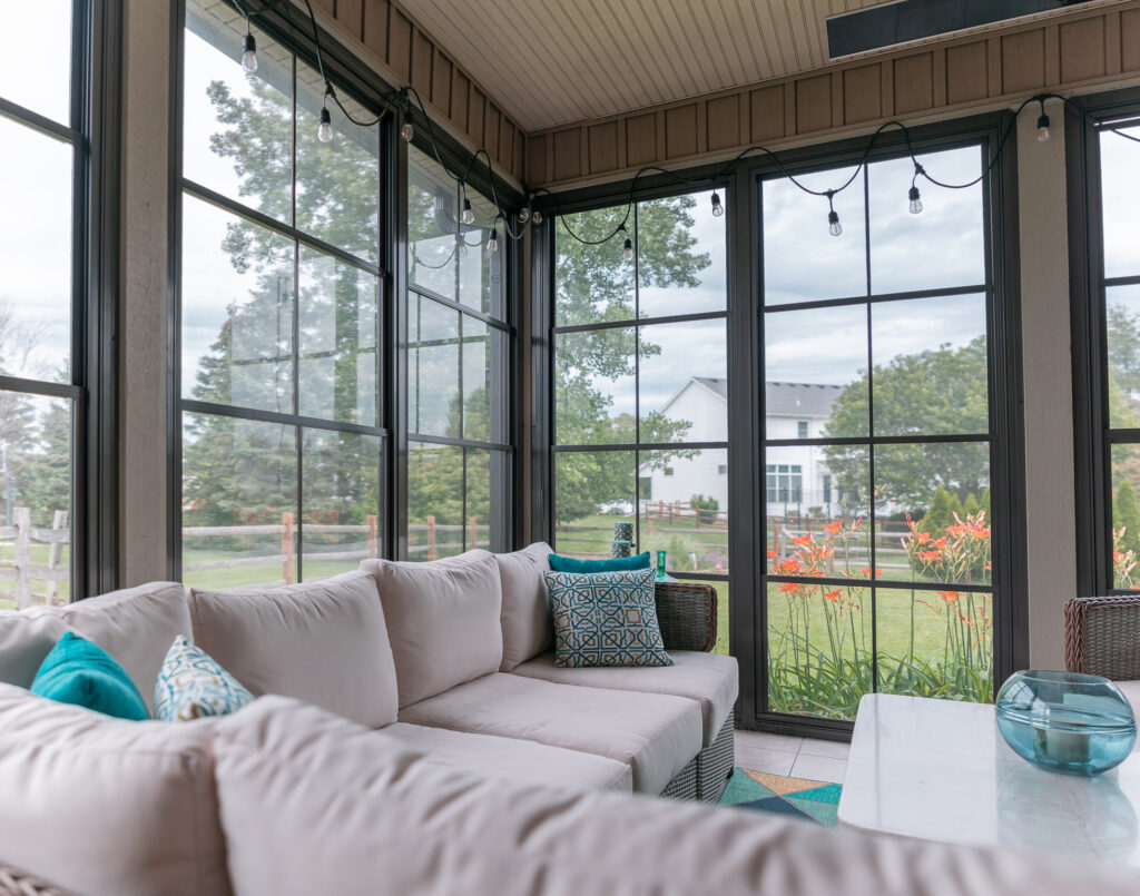 Kim's enclosed porch with bronze-frame vertical sliders