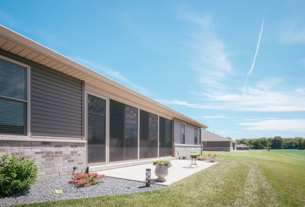Covered patio enclosed with screen and vinyl windows